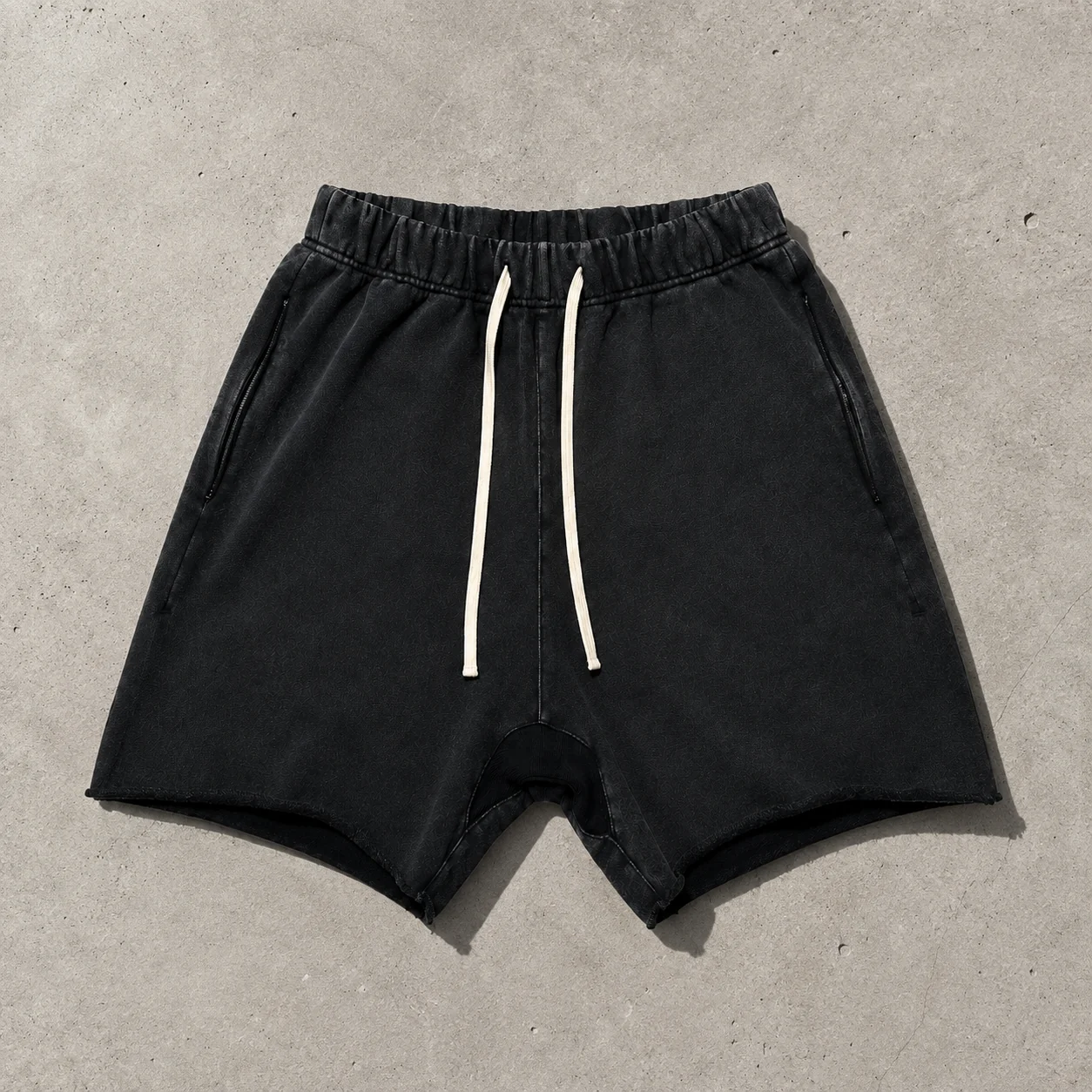 Garment detail flat lay on cement