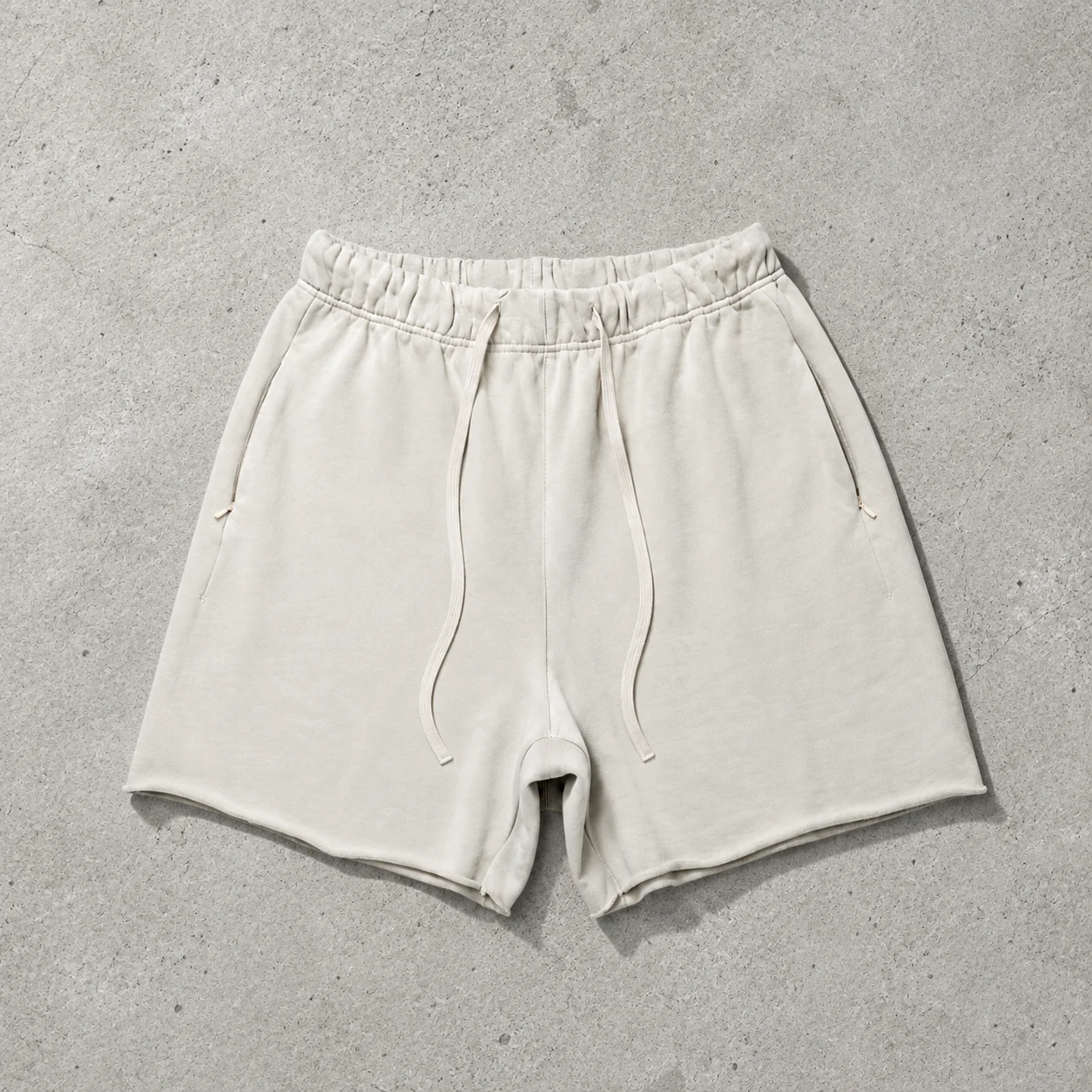 Apparel colorway flat lay on cement