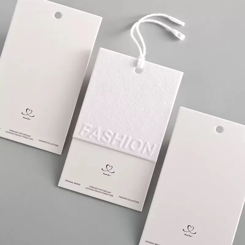 Three white fashion hangtag samples