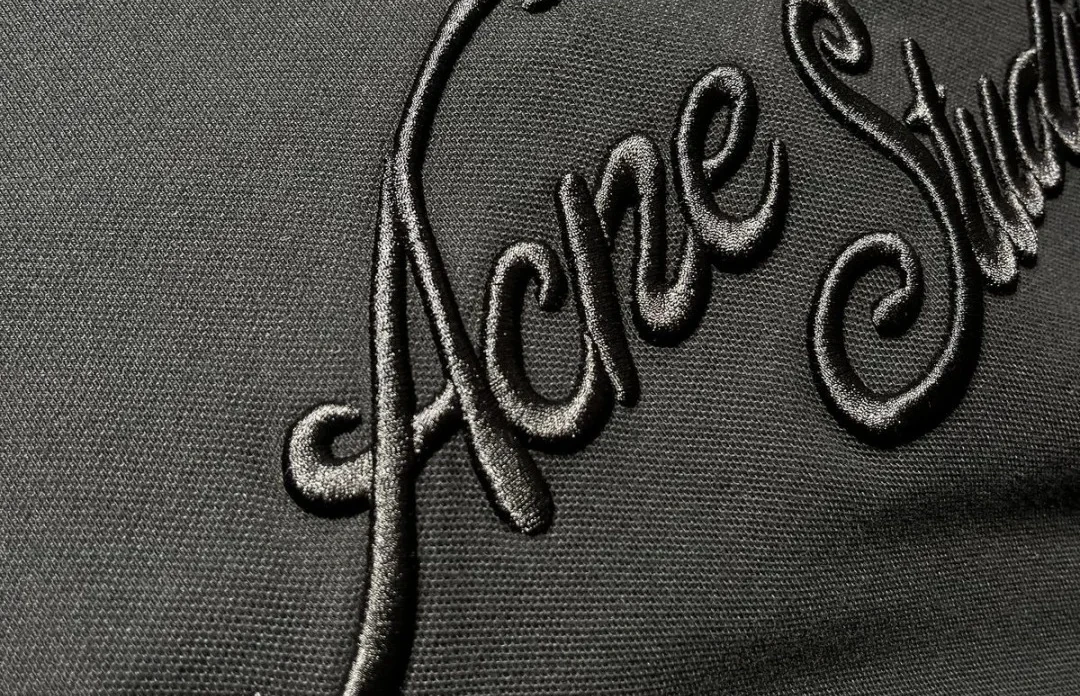 Tonal script embroidery