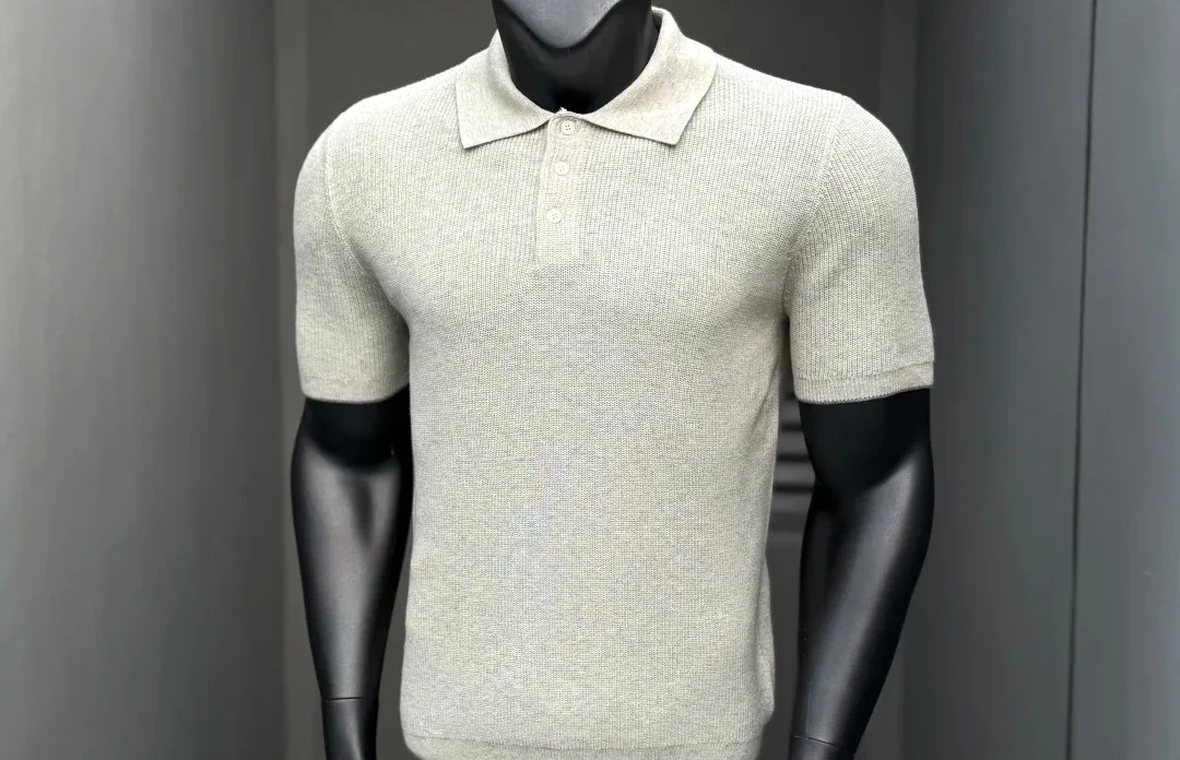 Premium knit polo on a mannequin