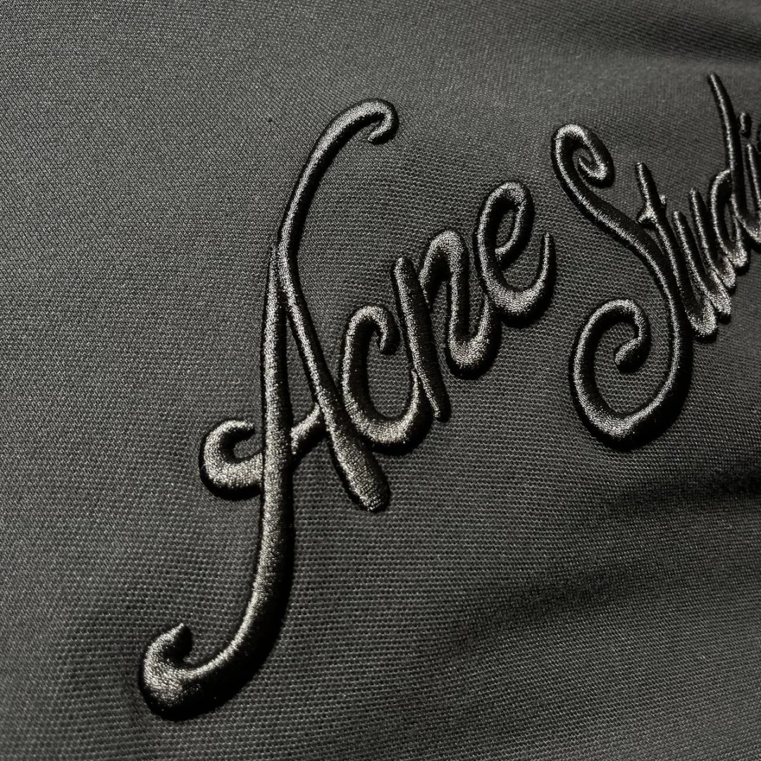 Tonal script embroidery