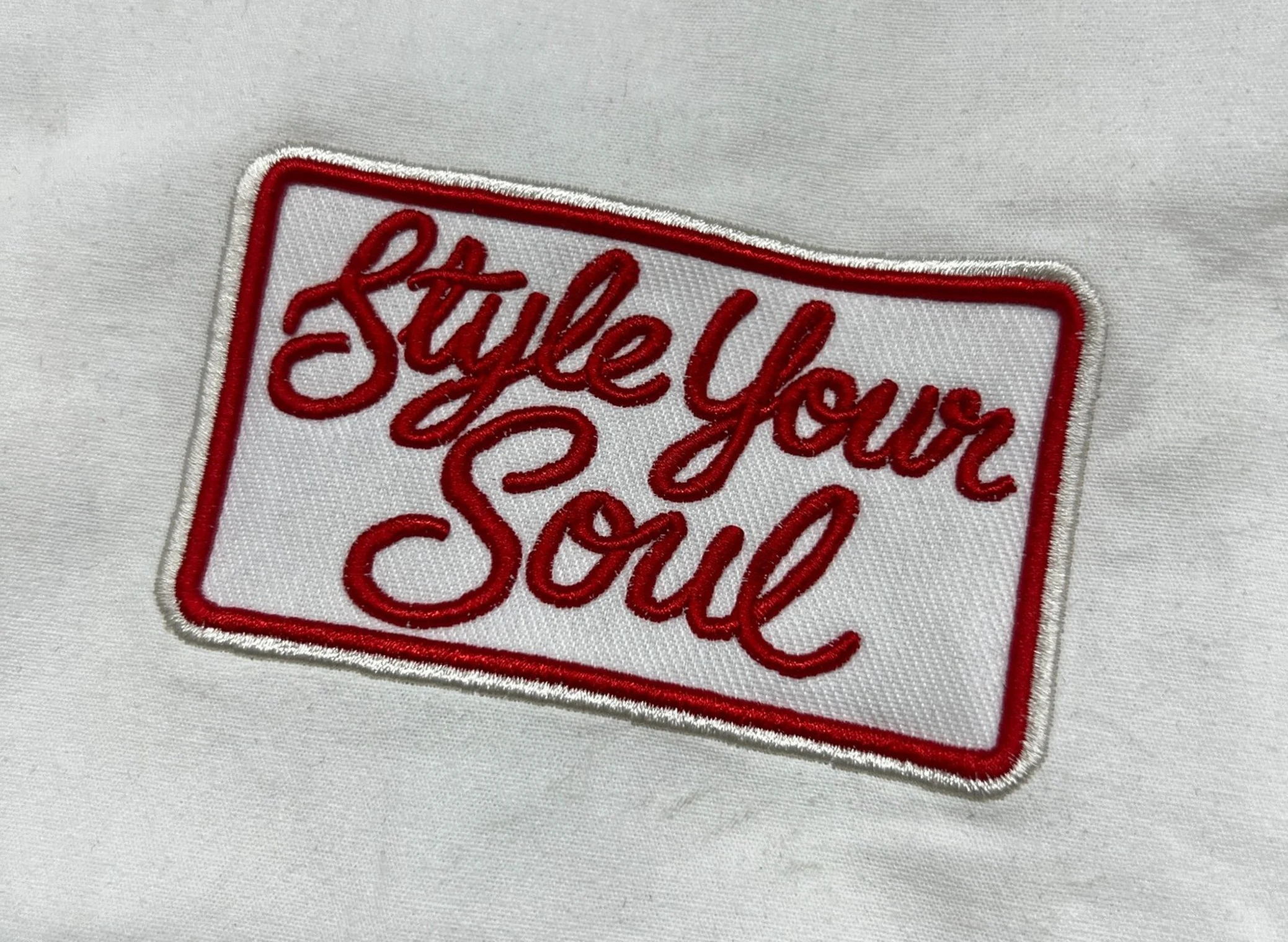 Embroidered logo detail on shirt